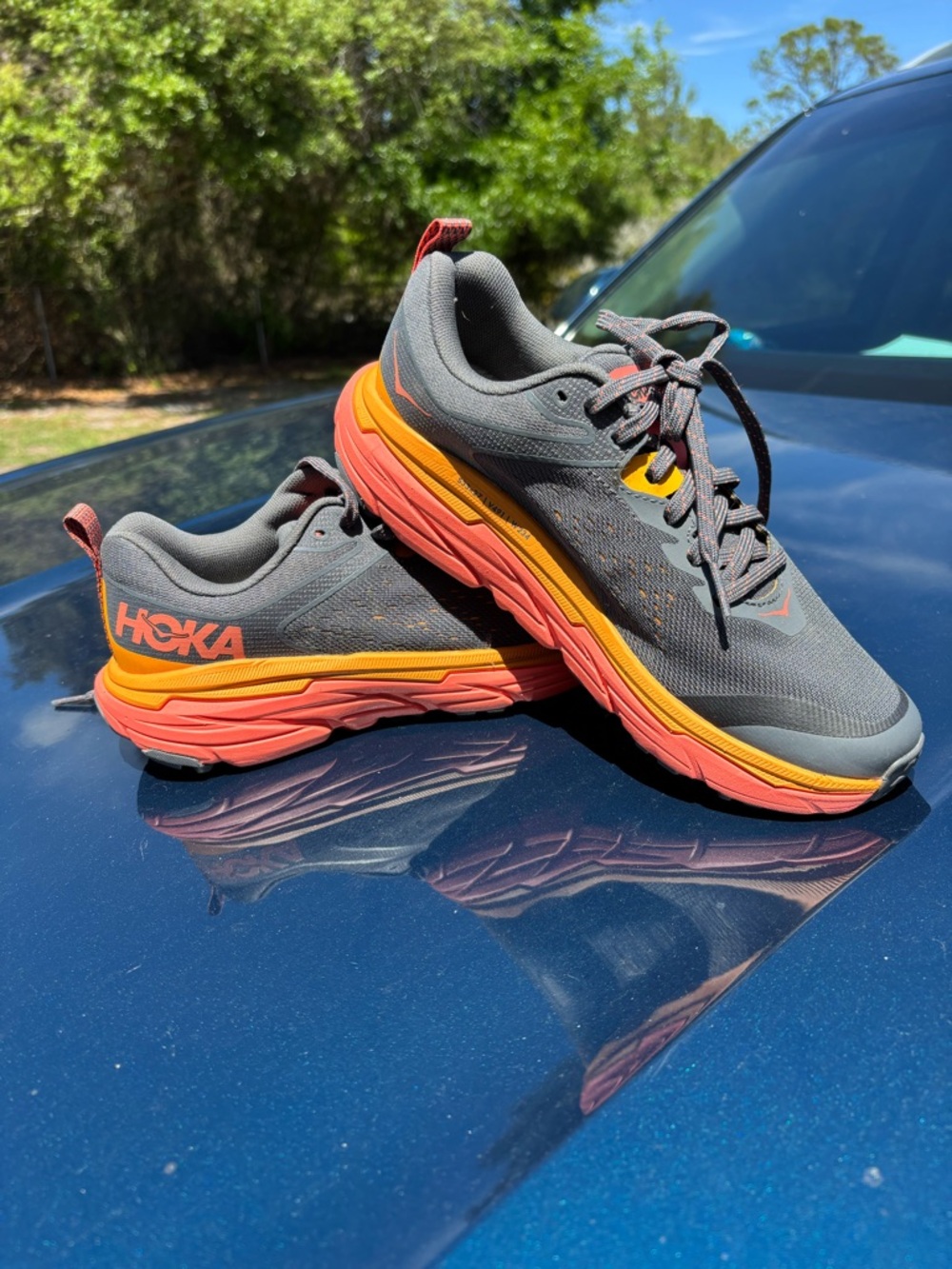 NWOT Hoka Gray Running Shoes with Orange and Coral Soles